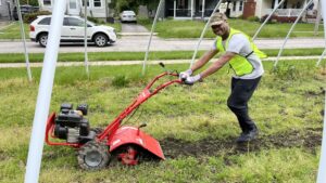 Man using rototiller