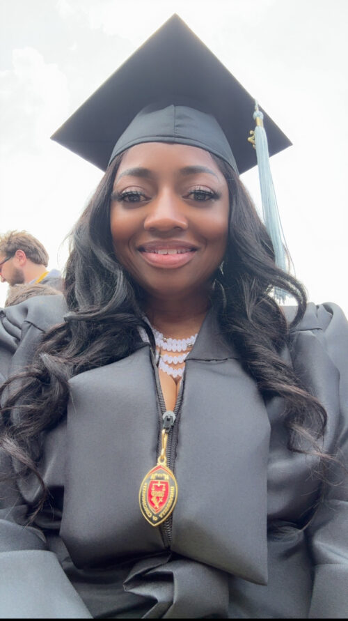 Black woman in cap and gown
