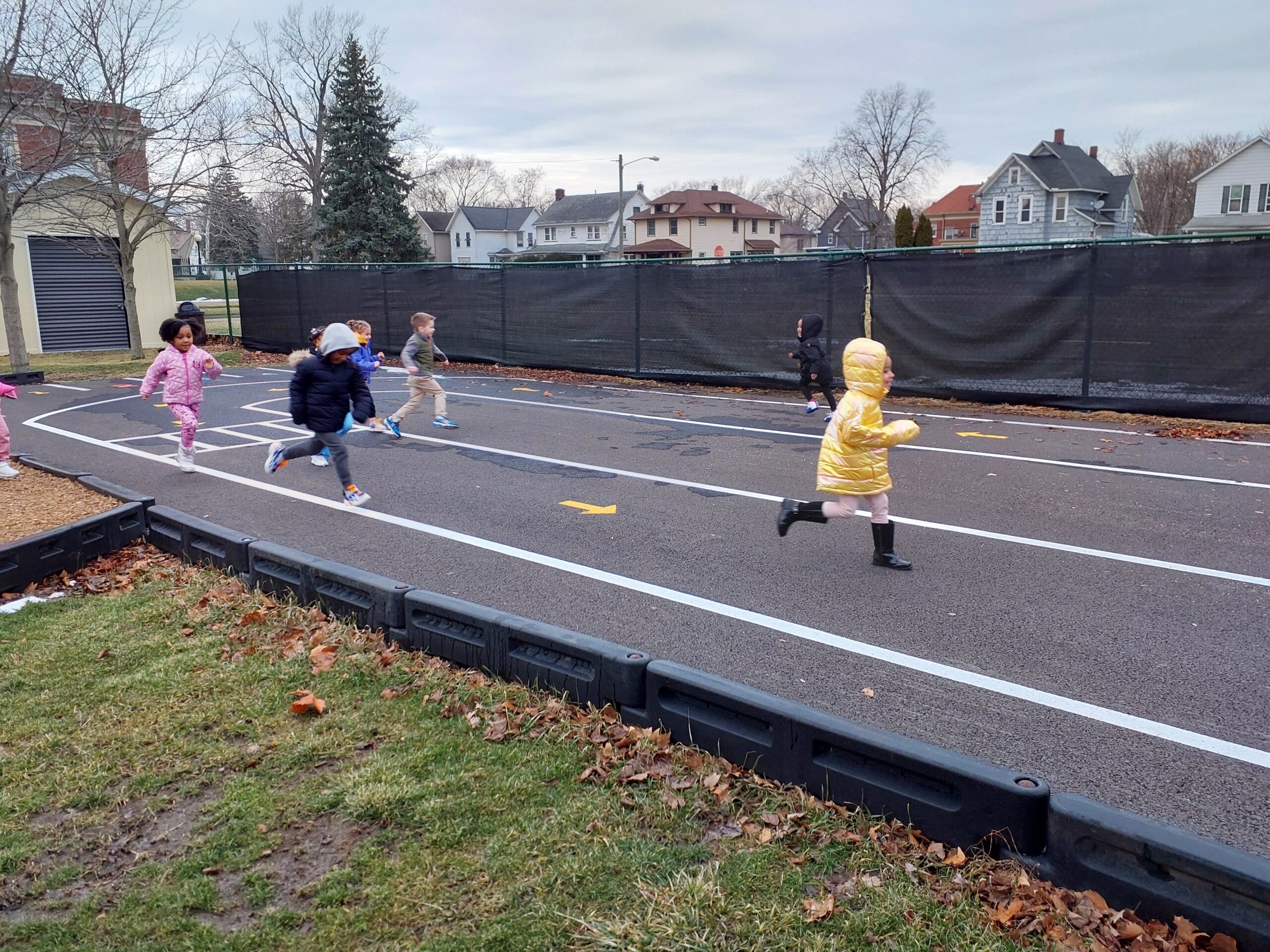 Outside 1 Preschoolers playing on outdoor track